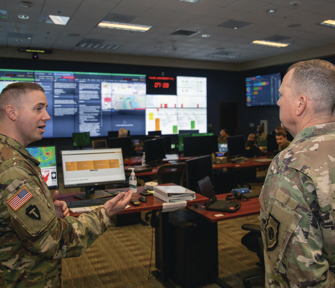 Army Lieutenant Colonel Loron Granthom demonstrates capabilities of Joint Task Force–Civil Support’s Joint Operations Center to General Gregory Guillot, commander, North American Aerospace Defense Command and U.S. Northern Command, at Joint Base Langley-Eustis, May 9, 2024 (U.S. Navy/Ryan Walvoord)
